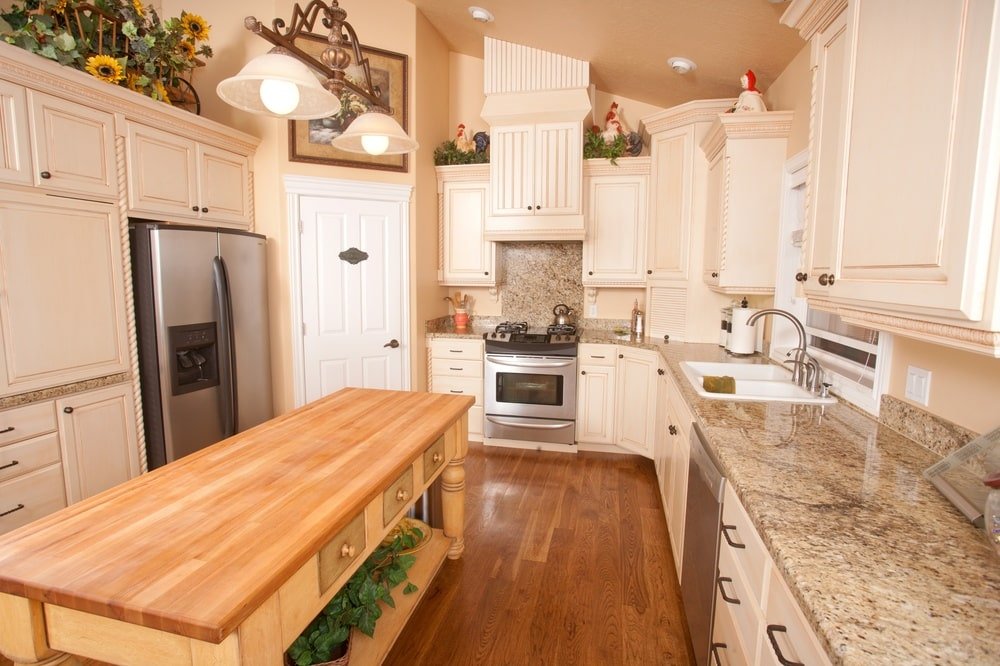kitchen with Rustic Kitchen Cabinets and wooden island