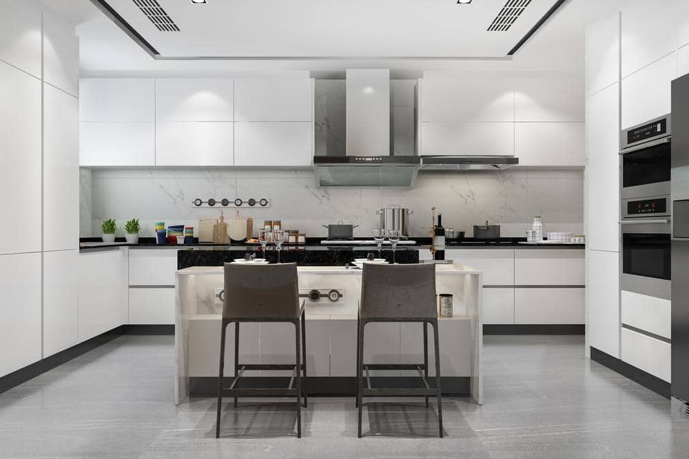 modern white kitchen with handleless cabinets and drawers island in middle