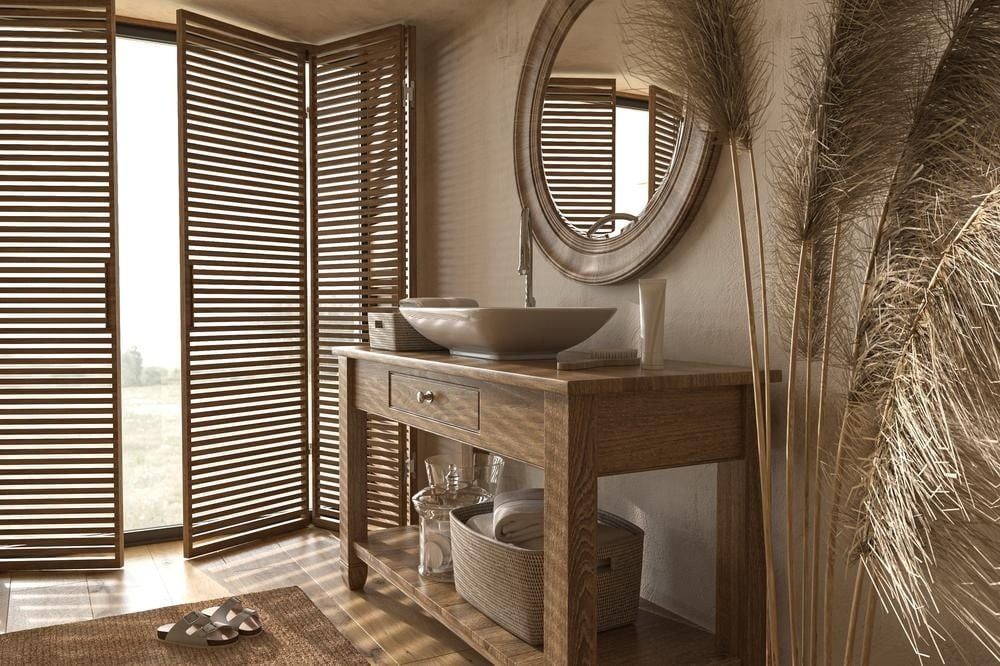bathroom with wooden vanity and mirror with wooden frame