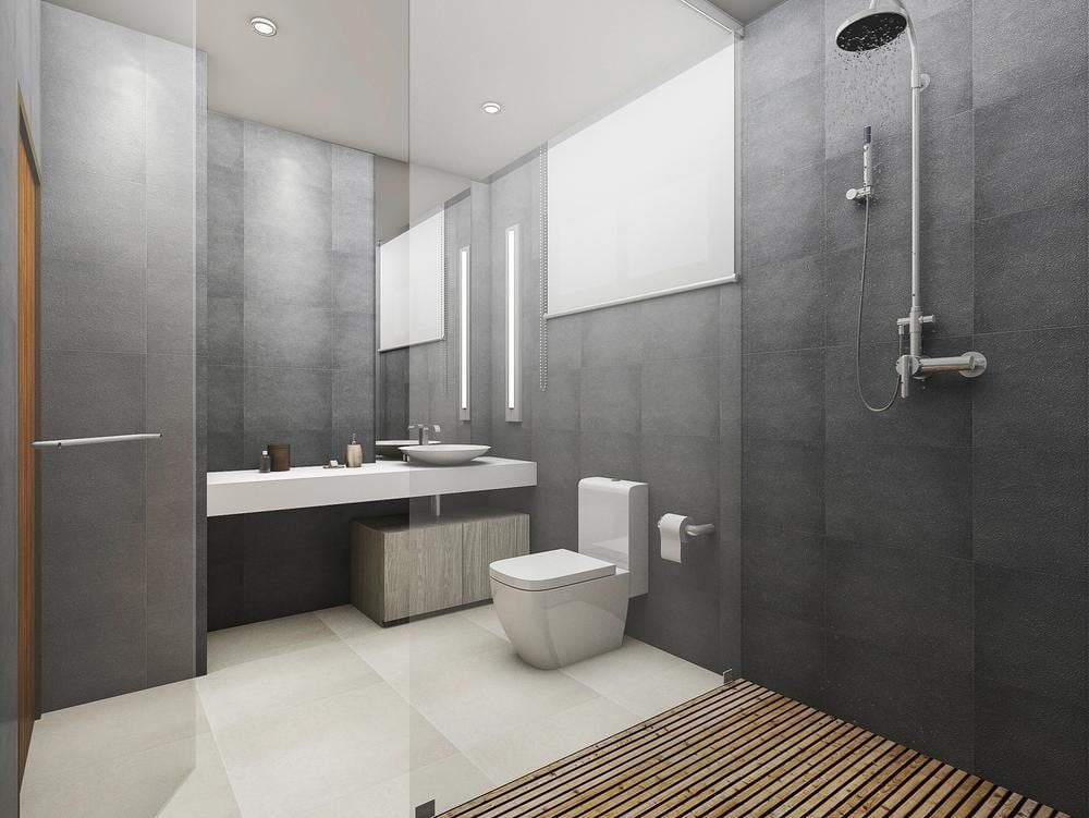 modern black tiled bathroom with glass shower area