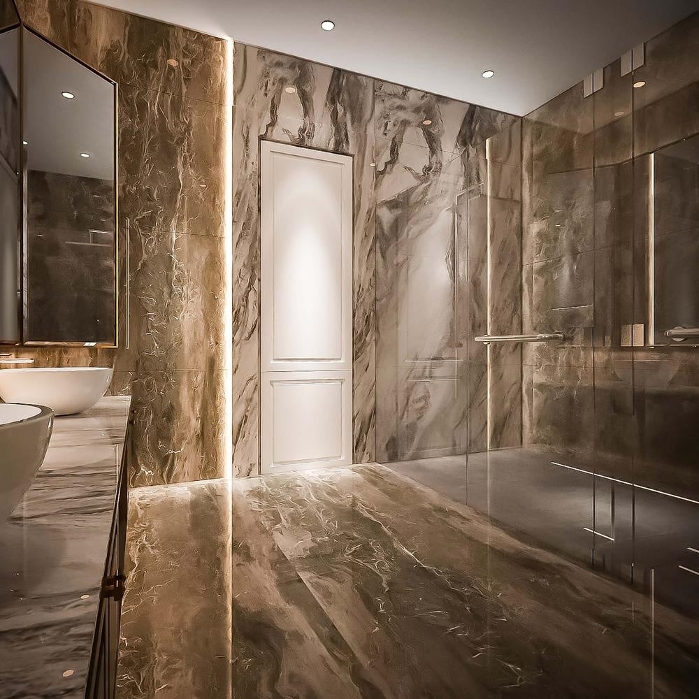 modern bathroom with brown tiled floor and walls with led lighting
