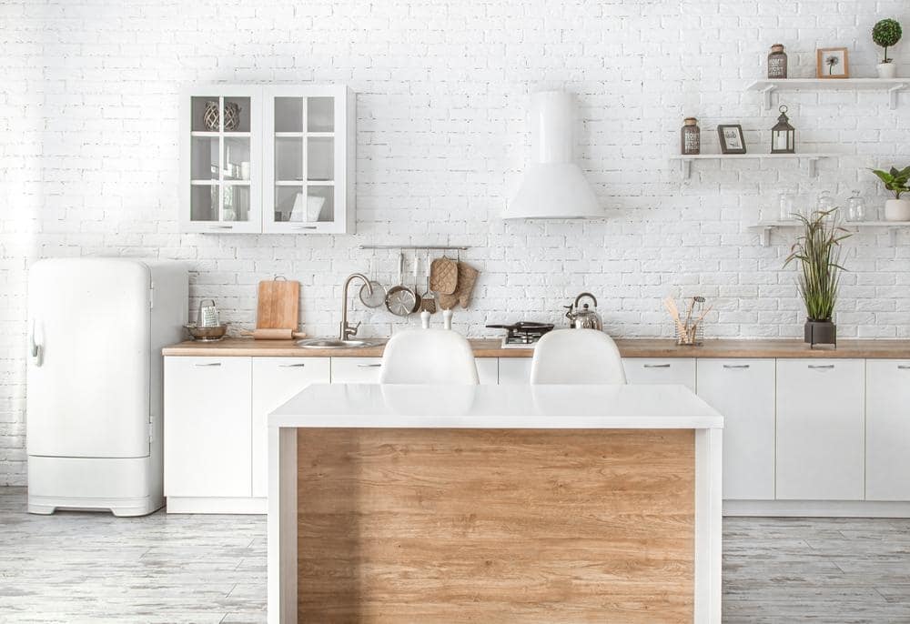 white kitchen design with wooden counter and white cabinets drawers