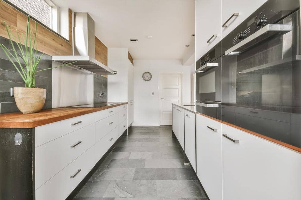 white and black kitchen drawers in a kitchen with galley shape