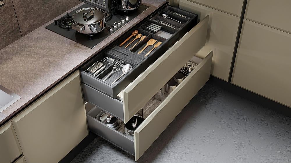 modern brown kitchen drawers full of kitchen utensils