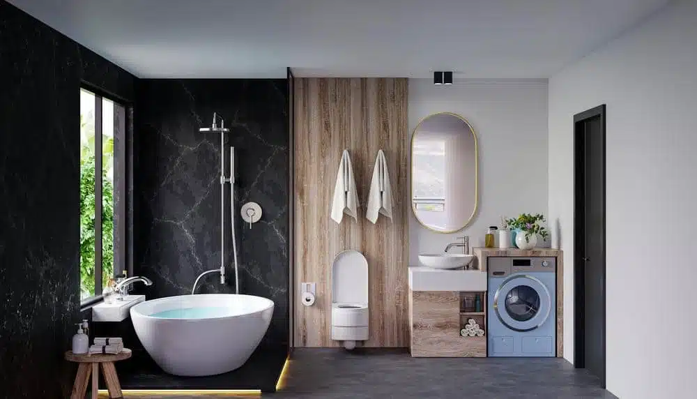 modern bathroom with a small tub and hanging towels on the wall