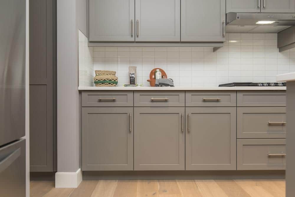 grey kitchen cabinets in wooden floor kitchen