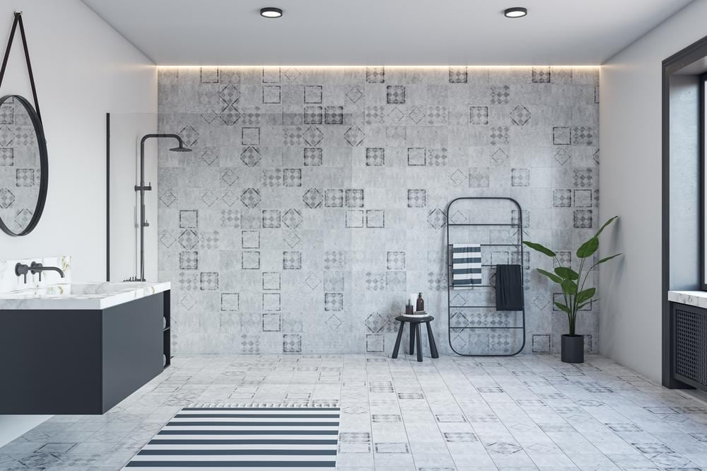 patterned floor and wall tiles in a modern bathroom
