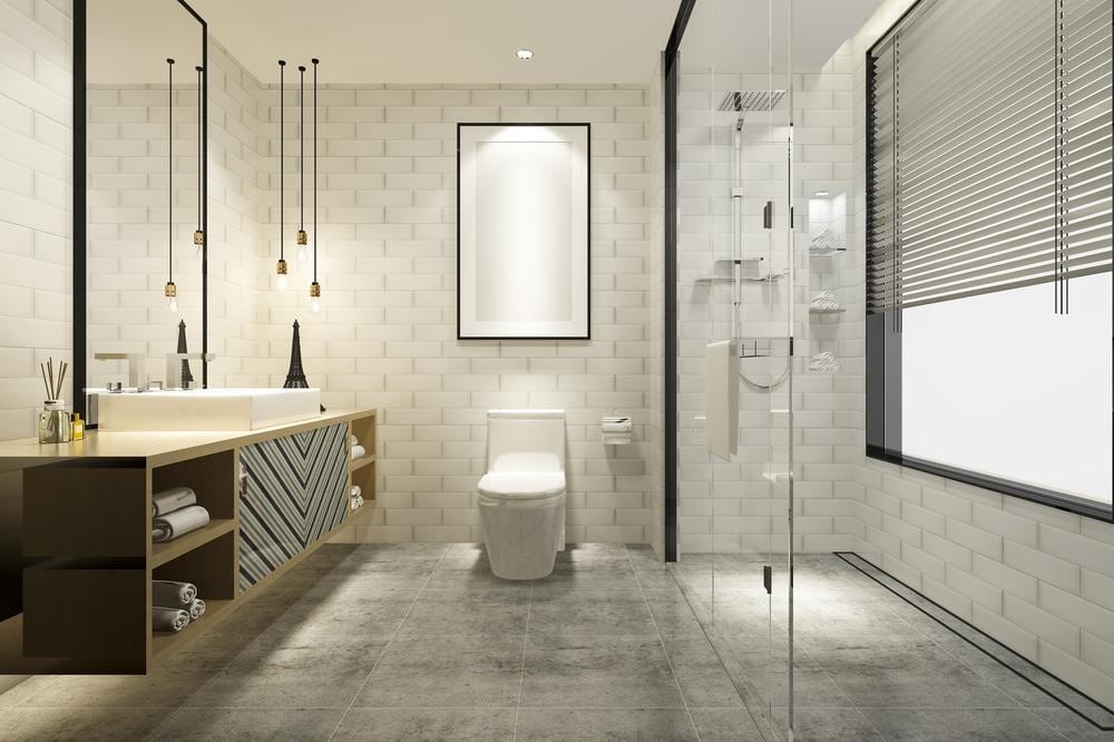 bathroom with modern floor tiles and glass shower area
