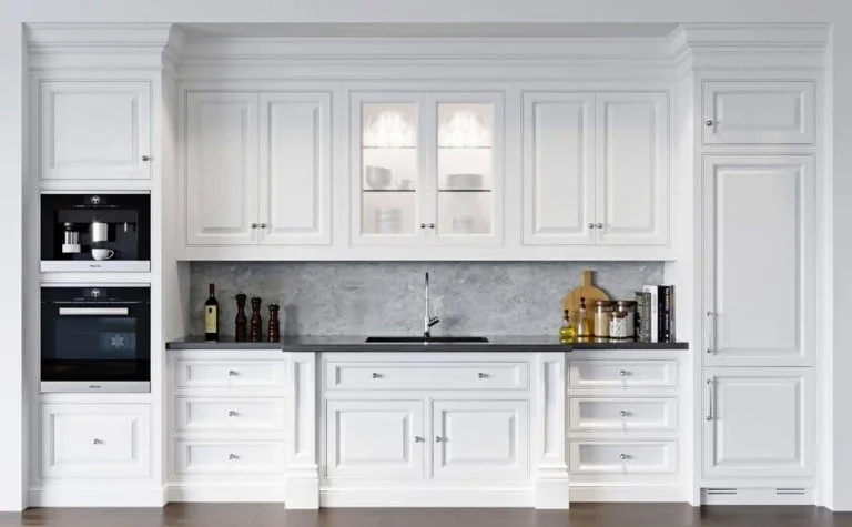 white shaker style kitchen cabinets and black countertop