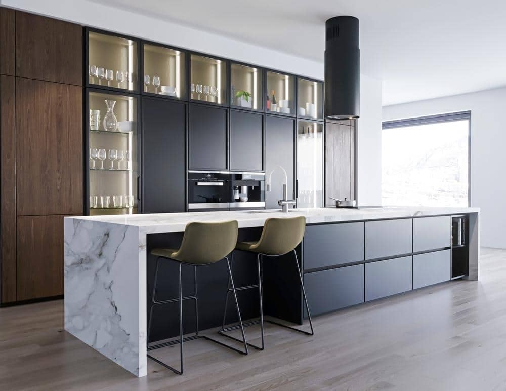 large modern black and white kitchen with large waterfall kitchen island