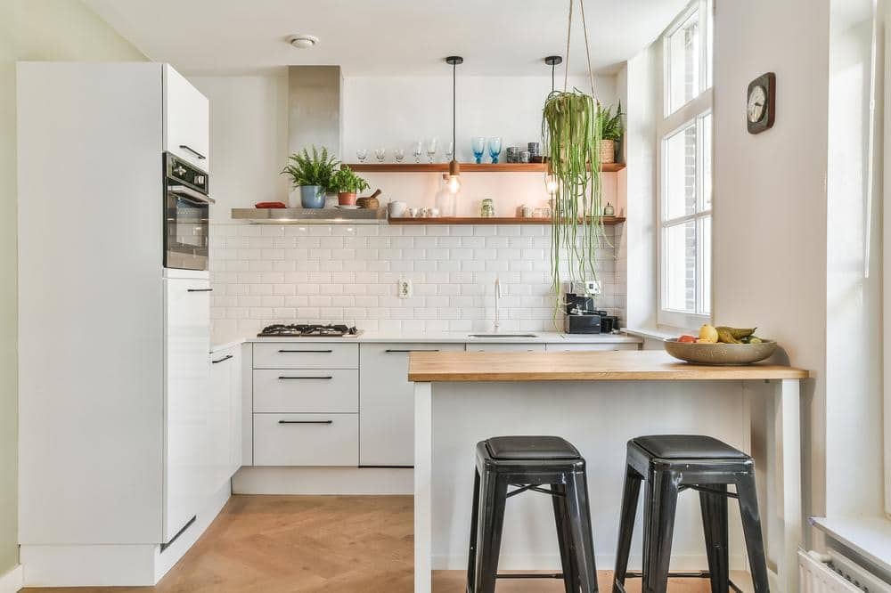 wooden counter kitchen island and white kitchen design